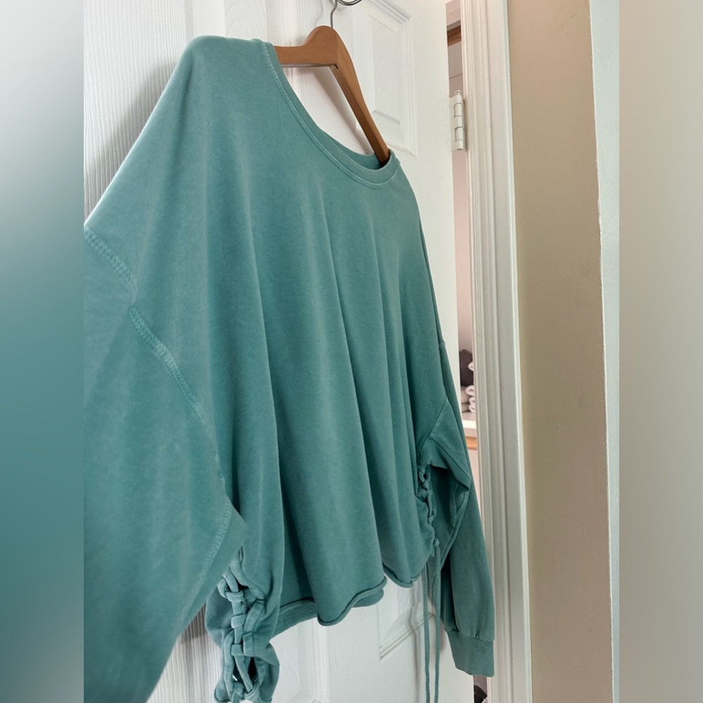 Super soft teal project social T sweatshirt.